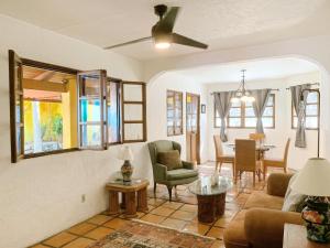 a living room with a couch and a table at Casa Hidalgo Hideaway in Chapala