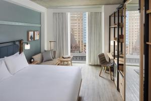 a hotel room with a bed and a large window at Hyatt Centric Center City Philadelphia in Philadelphia +76 photos