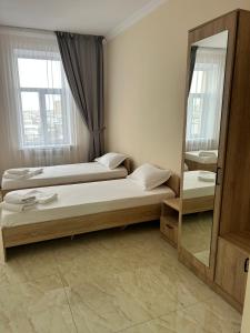 Postel nebo postele na pokoji v ubytování New hotel BEKARYS
