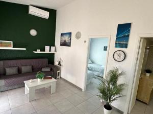 a living room with a couch and a table at Mar y Sol in Maspalomas