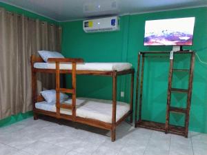 Ένα ή περισσότερα κρεβάτια σε δωμάτιο στο La Fortuna Brisas del Recuerdo