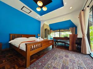 Postel nebo postele na pokoji v ubytování The Moon Rabbit Resort Pai