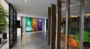 a lobby with a large painting on the wall at GreenTree Inn Fujian Fuzhou Software Park River View Business Hotel in Fuzhou