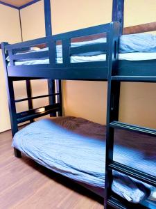 Una cama o camas en una habitación de A Lucky Hostel