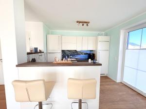 Kuchyň nebo kuchyňský kout v ubytování Ferienhaus Heimathafen Dranske