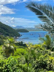 a view of a bay with boats in the water at Bayview Gardens Hotel in Labuan Bajo