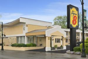 a motel sign in front of a hotel at Super 8 by Wyndham Belleville St. Louis Area in Belleville