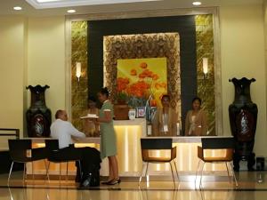a group of people sitting at a counter in a restaurant at Casa Boutique Hotel in Phnom Penh +162 photos