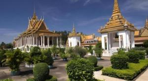 a group of temples with trees and bushes in a courtyard at Casa Boutique Hotel in Phnom Penh