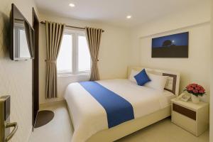 Ένα ή περισσότερα κρεβάτια σε δωμάτιο στο Thanh Downtown Hotel - Bước Chân Là Đến Chợ Đêm