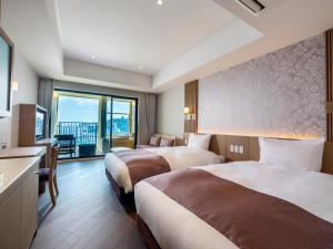 En eller flere senge i et værelse på La Vista Atami Terrace + 41 billeder