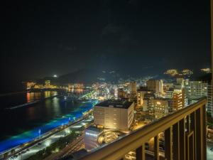 a view of a city at night from a balcony at La Vista Atami Terrace in Atami +79 photos