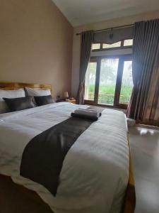 Ένα ή περισσότερα κρεβάτια σε δωμάτιο στο Greenfield-Lombok