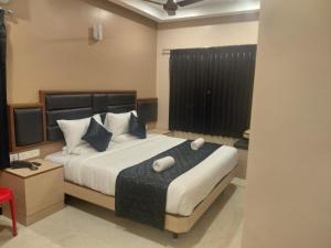 Ένα ή περισσότερα κρεβάτια σε δωμάτιο στο Majestic LAKEVIEW