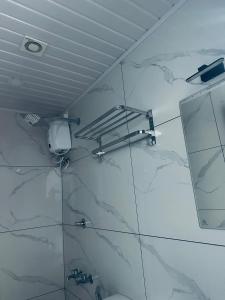 a bathroom with a mirror and a sink at RKM Pearl in Cochin +58 photos