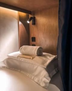 A bed or beds in a room at Yamato Hostel