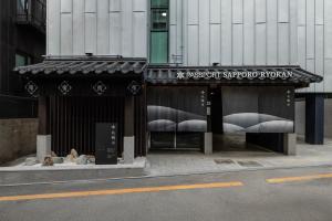 a store with an awning on a city street at Stay Passport Sapporo Ryokan Seoul Hongdae in Seoul