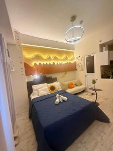 Ένα ή περισσότερα κρεβάτια σε δωμάτιο στο JNC Suites