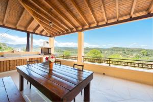 a dining room with a table and a view of the mountains at Theologos Traditional House in Theologos