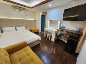 Ένα ή περισσότερα κρεβάτια σε δωμάτιο στο CK Inn