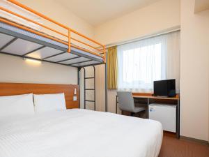 Una cama o camas en una habitación de Comfort Inn Niigata Chuo Inter