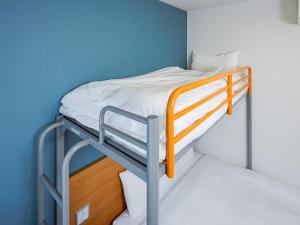 Кровать или кровати в номере Comfort Inn Karuizawa