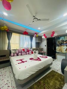 En eller flere senge i et værelse på Hotel HR GRAND