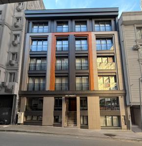 a large building with windows on a city street at Boamonti Residence Sisli Apart in Istanbul