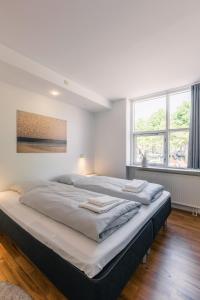 リーベにあるRibe Byferie Resortの大型ベッド1台(枕2つ付) +54枚の写真