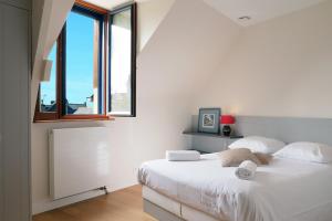 Giường trong phòng chung tại Les Chouettes