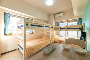 Postel nebo postele na pokoji v ubytování minpaku Blanco大須