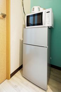 Kuchyň nebo kuchyňský kout v ubytování minpaku Blanco大須