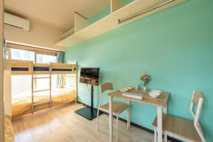 TV a/nebo společenská místnost v ubytování minpaku Blanco大須