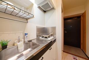 Kuchyň nebo kuchyňský kout v ubytování minpaku Blanco大須 + 21 fotografií