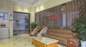 a lobby with a couch and chairs in a store at GreenTree Inn Sichuan Chengdu Airport Road Express Hotel in Chengdu