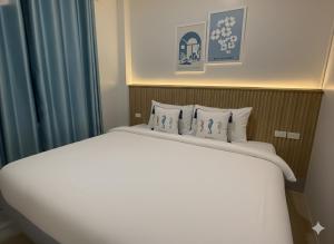 Ένα ή περισσότερα κρεβάτια σε δωμάτιο στο Soft Blue Home, Krabi Town