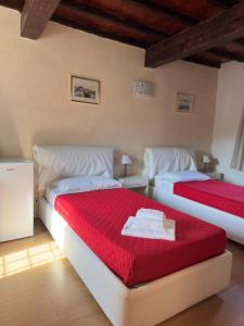 Ένα ή περισσότερα κρεβάτια σε δωμάτιο στο Villa Cittadella