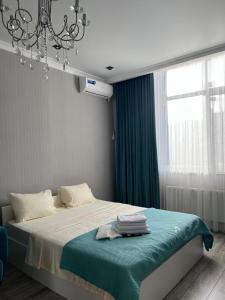 Postel nebo postele na pokoji v ubytování Квартира посуточно