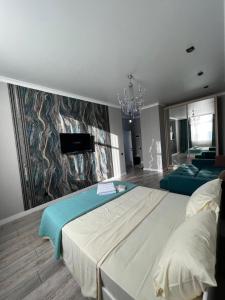 Postel nebo postele na pokoji v ubytování Квартира посуточно