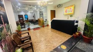 a lobby with chairs and a reception desk in a building at legacy of chittorgarh in Chittaurgarh