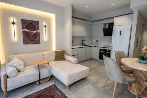 a living room with a couch and a table at Boamonti Residence Sisli Apart in Istanbul