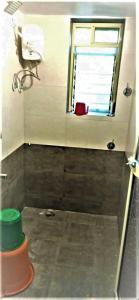 a small bathroom with a window and a shower at Calm Studio 6 in Jāmb