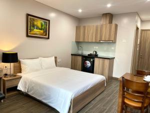 Giường trong phòng chung tại Fumi Residence Hanoi +15 ảnh