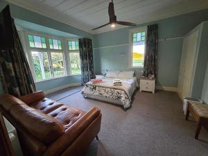 Ένα ή περισσότερα κρεβάτια σε δωμάτιο στο Greenfield Country Homestay