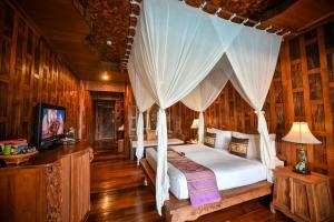 En eller flere senge i et værelse på Santhiya Koh Phangan - Supreme Deluxe Pool Access