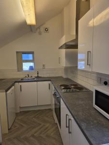 Η κουζίνα ή μικρή κουζίνα στο The Cosy House