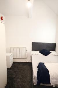 Ένα ή περισσότερα κρεβάτια σε δωμάτιο στο The Cosy House