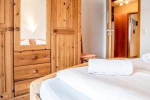 Ένα ή περισσότερα κρεβάτια σε δωμάτιο στο Haus Horizont I HZ06