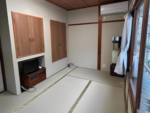 Ένα ή περισσότερα κρεβάτια σε δωμάτιο στο Takao Kanko Hotel +68 φωτογραφίες