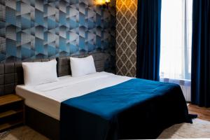 Ένα ή περισσότερα κρεβάτια σε δωμάτιο στο Chuxuryurd Hotel